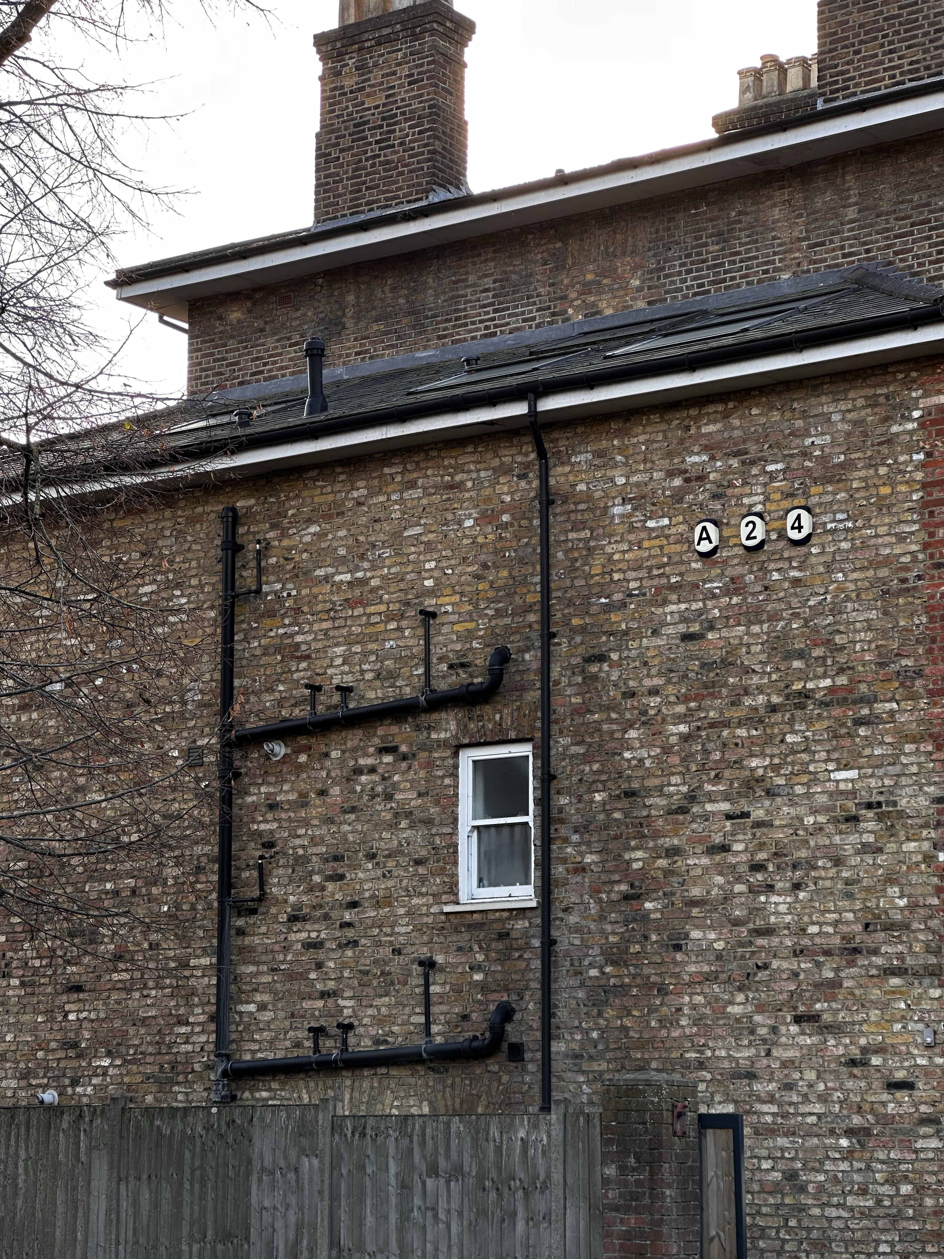 1549-brick-house-facade-small-windows-brown-black-portrait-paul-underwood-original-work.png