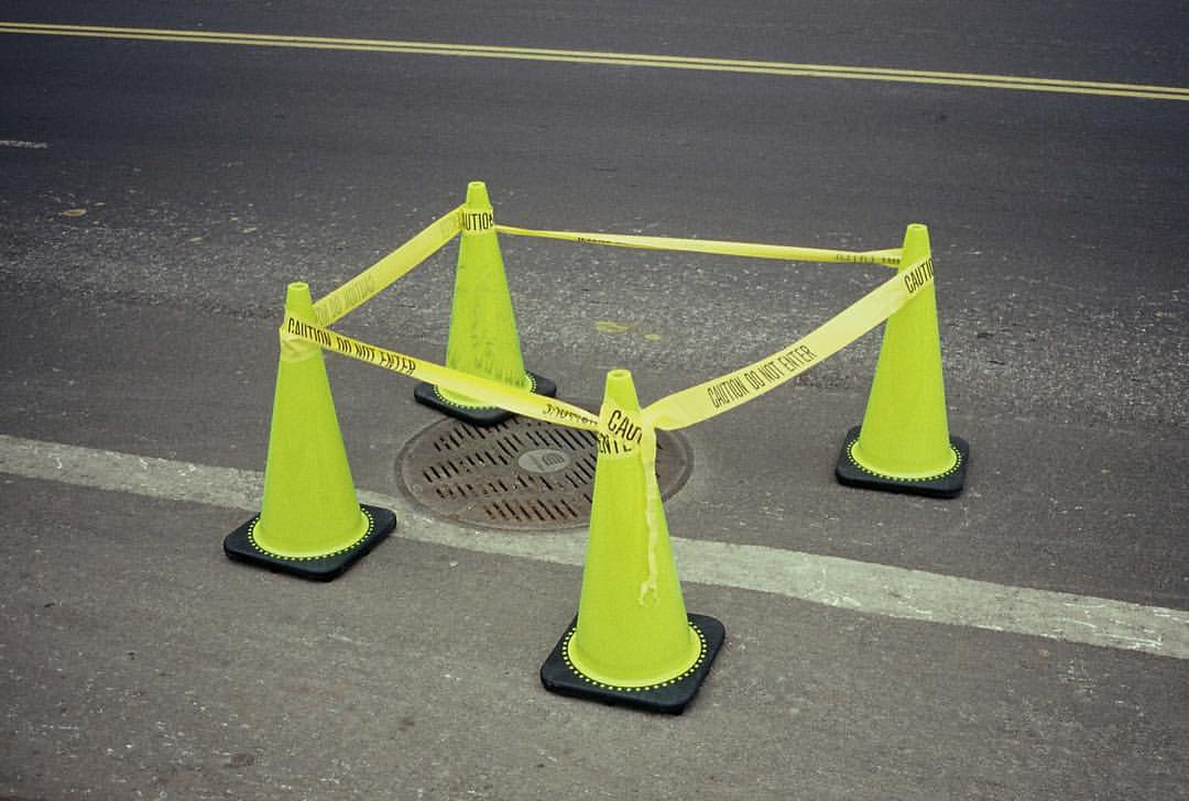 0779-bdom06kzali-nyc-manholecover-dontfallin-trafficcone-brown-grey-landscape-image-paul-underwood-original-work.jpg