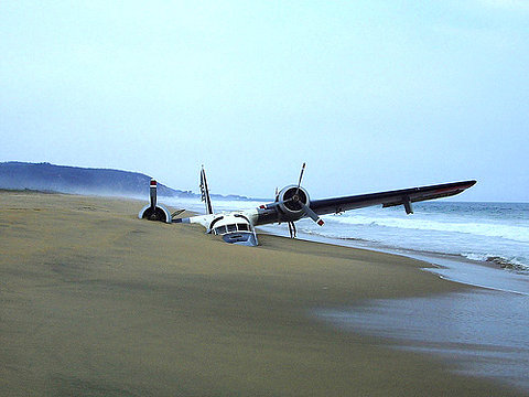 0926-ooops-plane-beach-sand-water-art-installation-crash-white-brown-landscape-image-reference-only.jpg