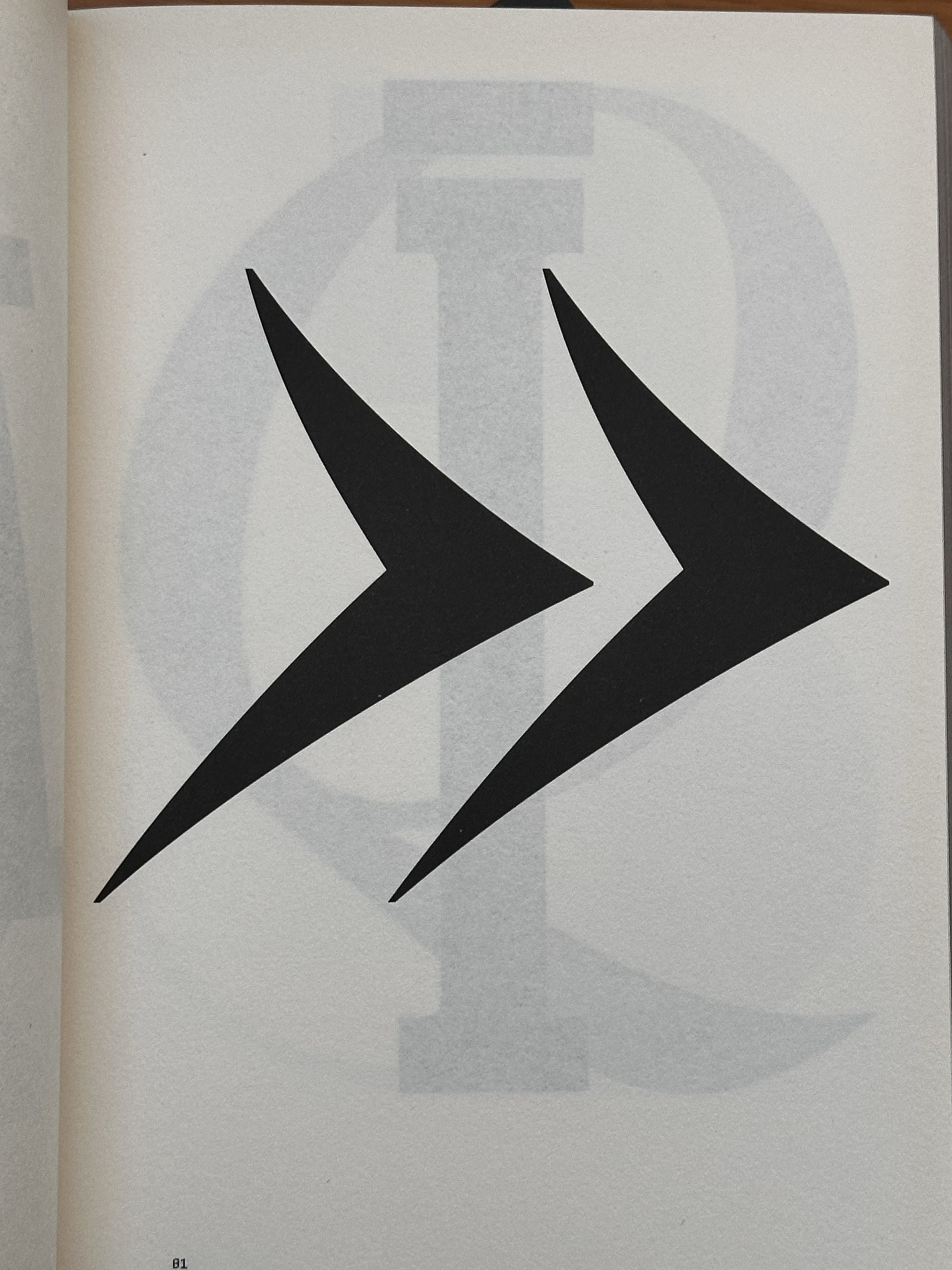 1575-black-double-arrow-symbol-white-paper-beige-brown-portrait-reference-only.png