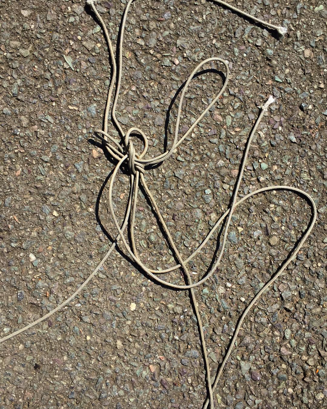 0959-bu4mfkvd3dw-knots-road-string-details-grey-brown-portrait-image-paul-underwood-original-work.jpg