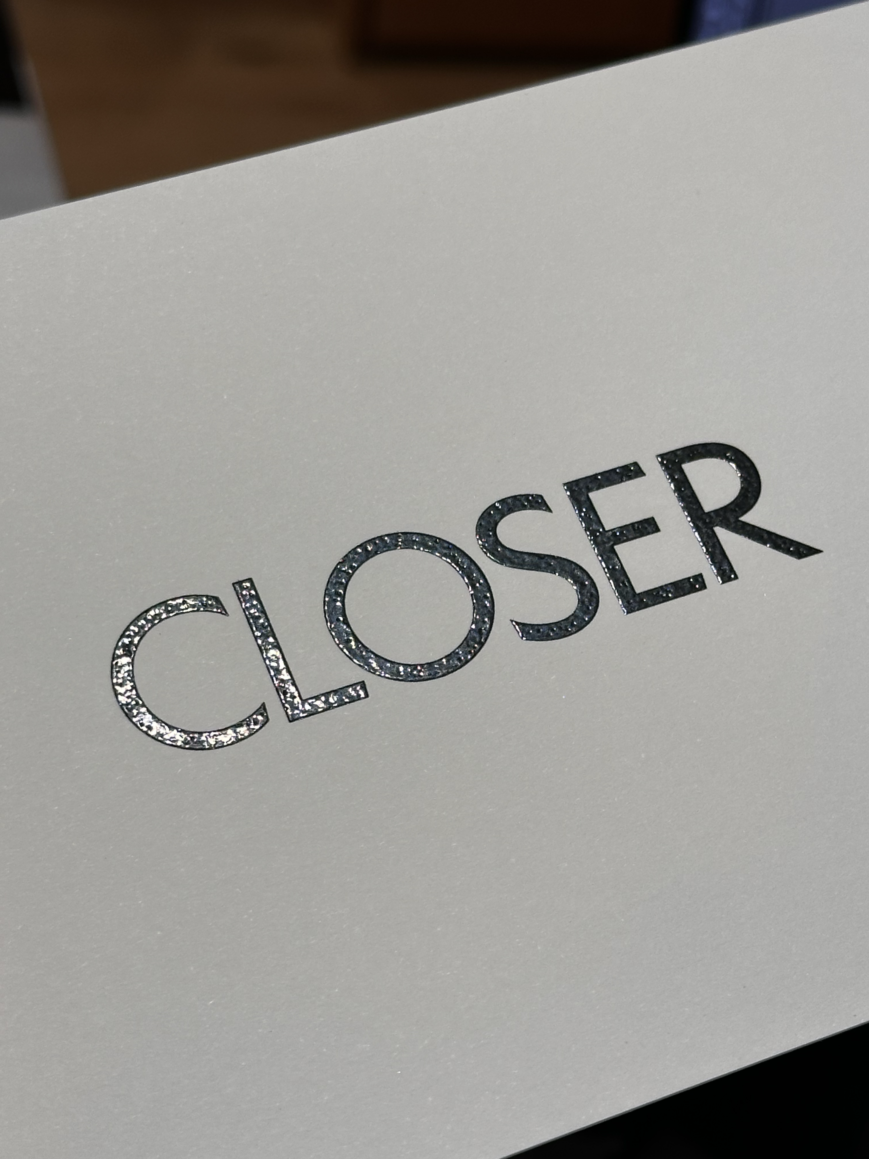 1547-closer-metallic-lettering-white-card-beige-brown-portrait-paul-underwood-original-work.png