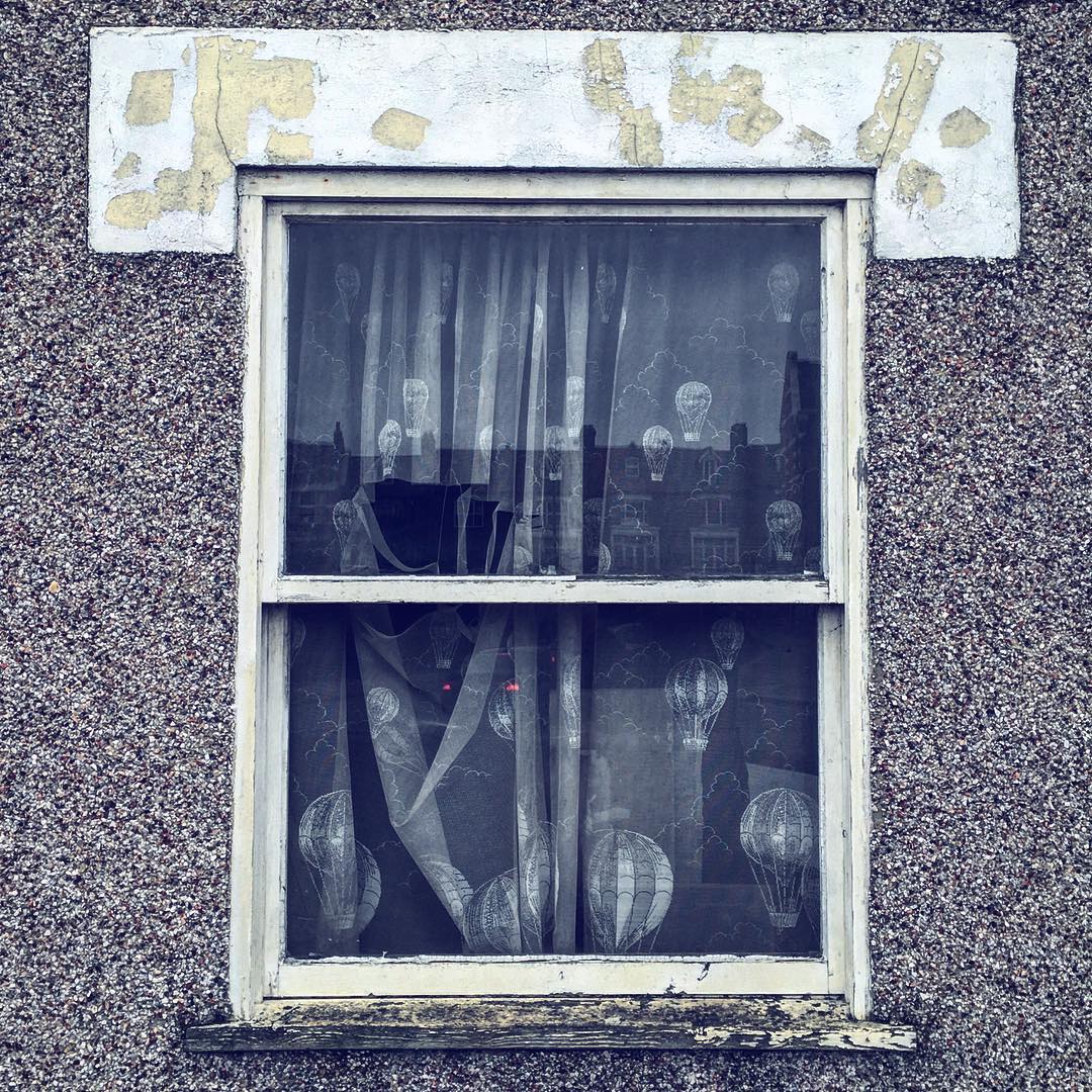 0708-bbcdya9tajd-window-balloons-hot-air-grey-brown-square-image-paul-underwood-original-work.jpg