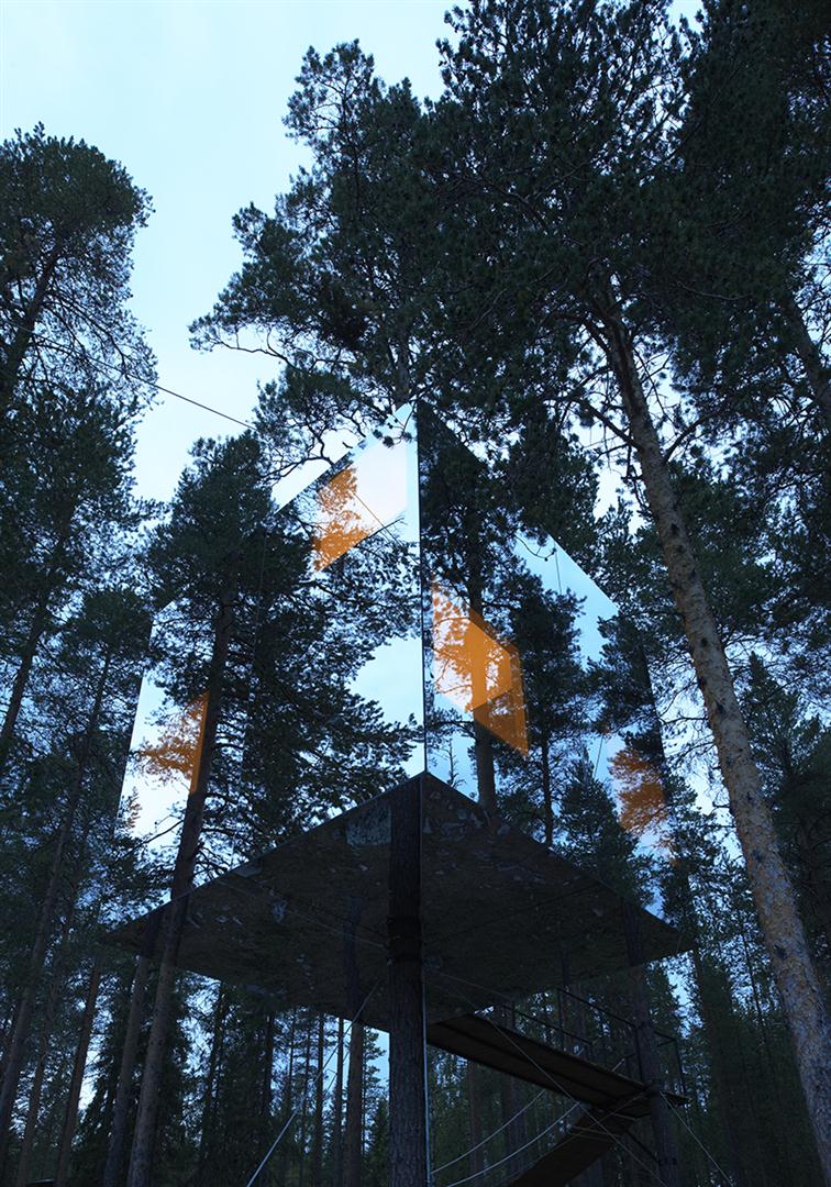 0409-dezeen-special-feature-ten-amazing-hotel-designs-including-mirrored-glass-box-forrest-sweden-suspended-black-green-portrait-image-reference-only.jpg